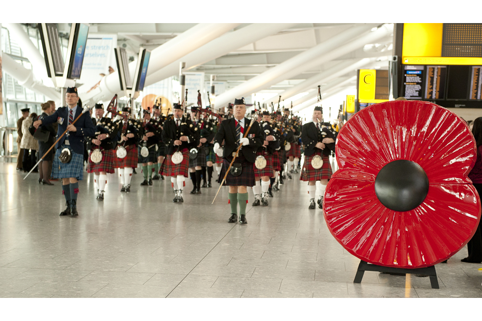 Pipers and drummers at Heathrow Airport