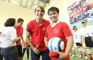 Arsenal players play football with visually impaired children in Hanoi