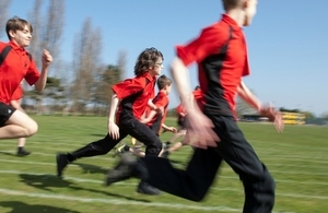 Pupils running outdoors