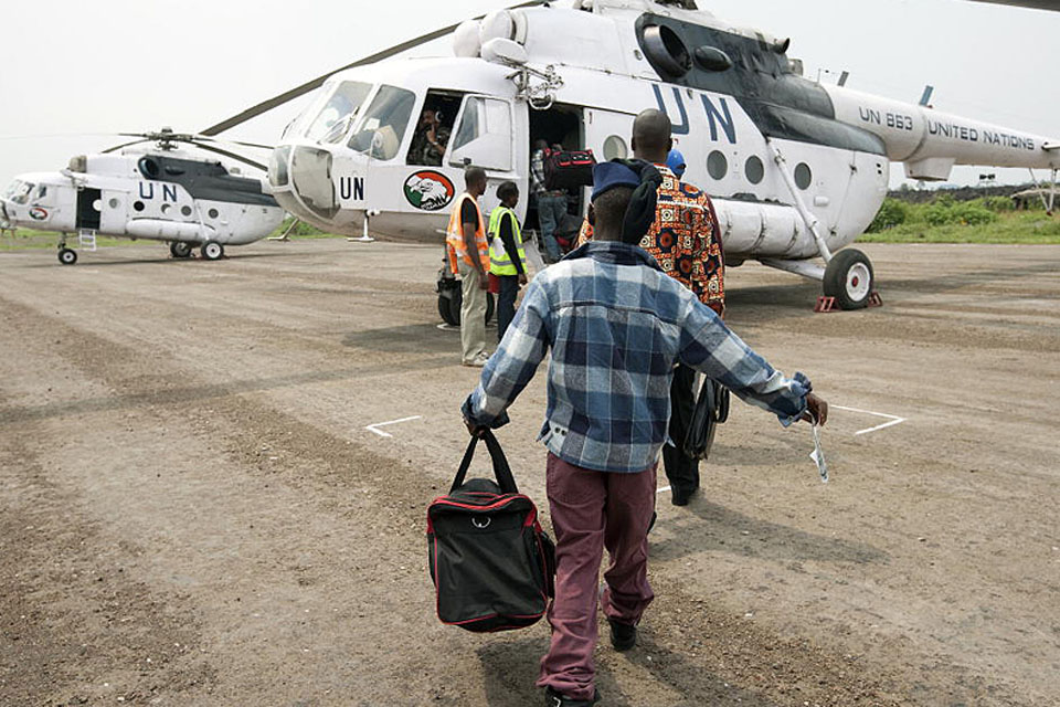 Former child soldiers board a helicopter flight of the United Nations Organisation Mission in the Democratic Republic of the Congo (MONUC) for repatriation to undisclosed regions of the country