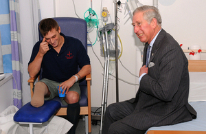 Prince Charles shares a joke with Marine Adam Coatsworth during his visit to the Queen Elizabeth Hospital Birmingham [Picture: Crown copyright, University Hospitals Birmingham NHS Foundation Trust]