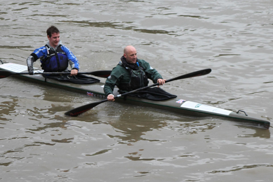 Royal Marines Captain Jon White and Colour Sergeant Lee John Waters in their canoe on the River Thames