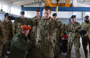 Marine Specialist Bo Torsen Jensen demonstrates how to carry out a body search [Picture: Corporal Richard Cave RLC, Crown copyright]