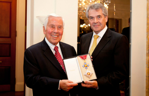 Ambassador Peter Westmacott presents former US Senator Richard Lugar with the insignia of the Knight Commander of the Most Excellent Order of the British Empire (KBE) at the British Embassy in Washington.
