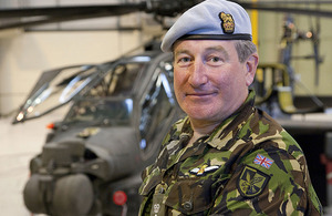 Colonel Neale Moss, pictured in front of an Apache attack helicopter at Wattisham Flying Station near Ipswich
