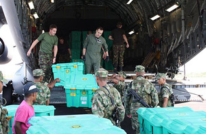 ShelterBoxes are unloaded from a RAF C-17 transport aircraft at Cartagena Airport in Colombia