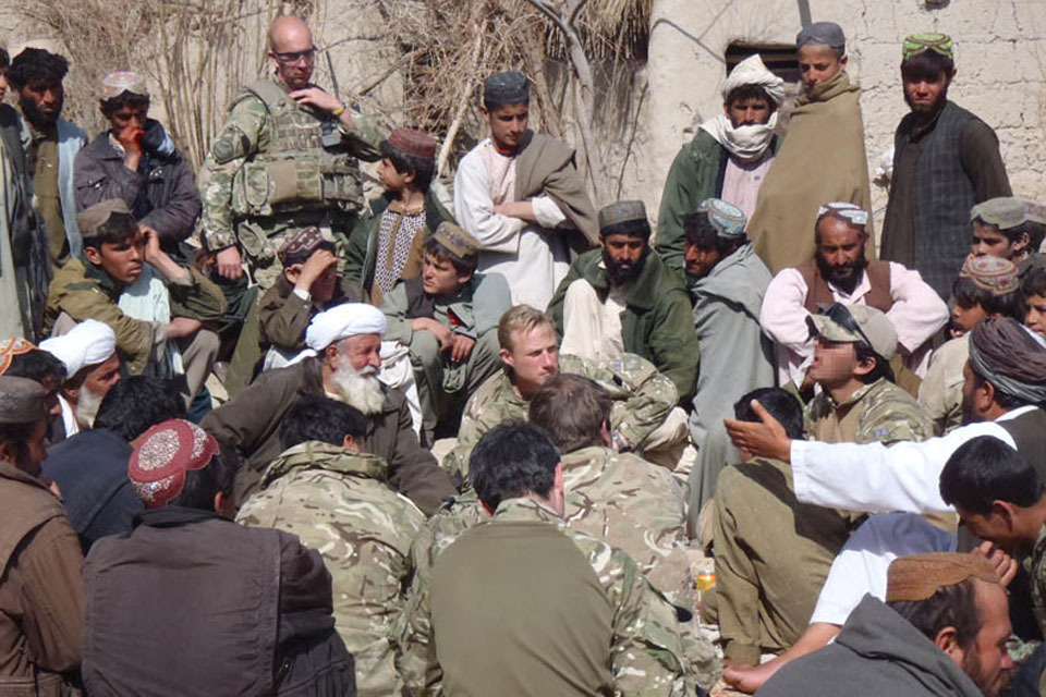 British soldiers hold a shura with Afghan villagers in Helmand province (library image)