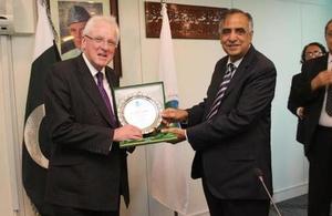 The Lord Mayor of London, Alderman Dr Andrew Parmley, receiving a shield from Muhammad Zafar-ul-Haq Hijazi, Chairman of the Securities and Exchange Commission of Pakistan after their meeting in Islamabad.