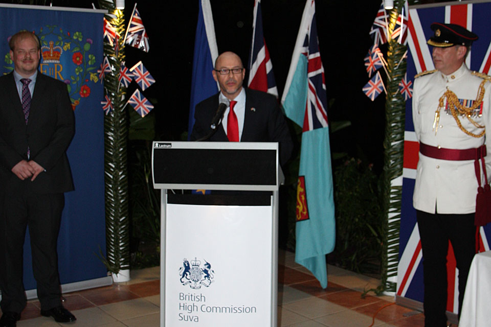 Steven Chandler Acting High Commissioner delivers his speech at the Queen's Birthday Party. Standing on his left is Lieutenant-Colonel Tim Woodman (Wellington-based UK Defence Attaché) and on his right is Dan Salter (Deputy High Commissioner).