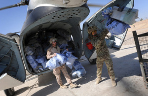 Troops unload bags of Christmas mail from the UK at Camp Bastion, Afghanistan (library image) [Picture: Corporal Mike O'Neill, Crown copyright]
