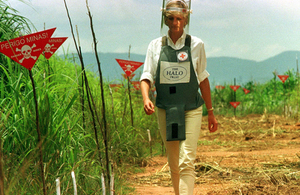 Diana, Princess of Wales, walks in one of the safety corridors of the landmine fields of Huambo, Angola, during a visit to the country in 1997.