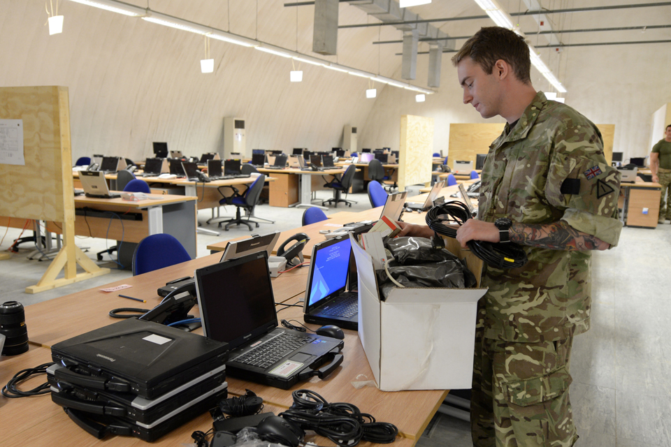 215 Signal Squadron personnel installing communications equipment