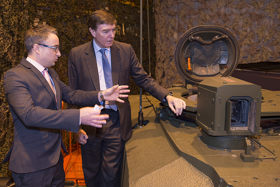 Adam Clark with Philip Dunne on a Challenger 2 tank