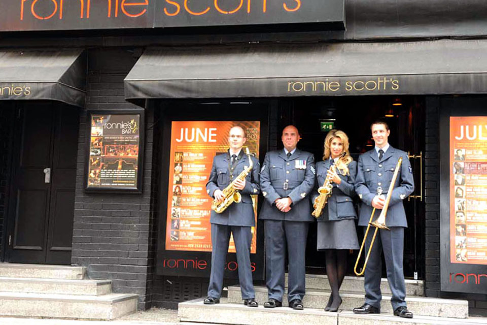 Stacey Solomon with some of the RAF Squadronaires outside Ronnie Scott's club in London