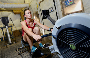 Captain Heather Stanning training on a rowing machine at Camp Bastion, Afghanistan (library image) [Picture: Sergeant Dan Bardsley, Crown copyright]