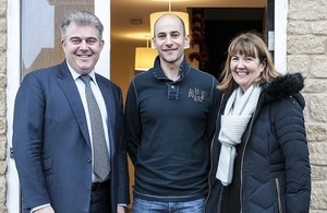 Brandon Lewis with home owner Chris and Heather Bowman from Sovereign Housing Association