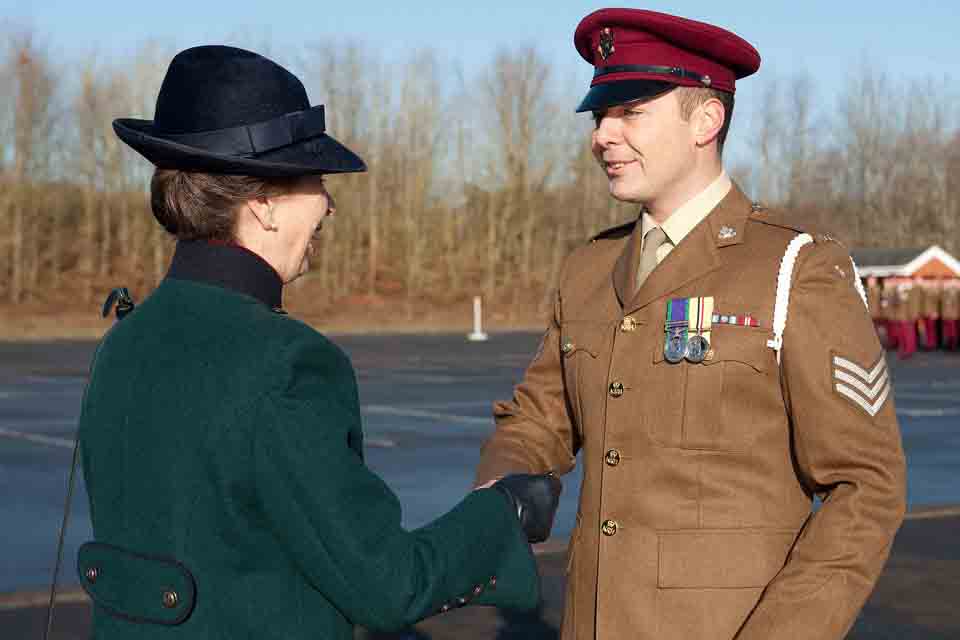The Princess Royal presents a soldier with a medal