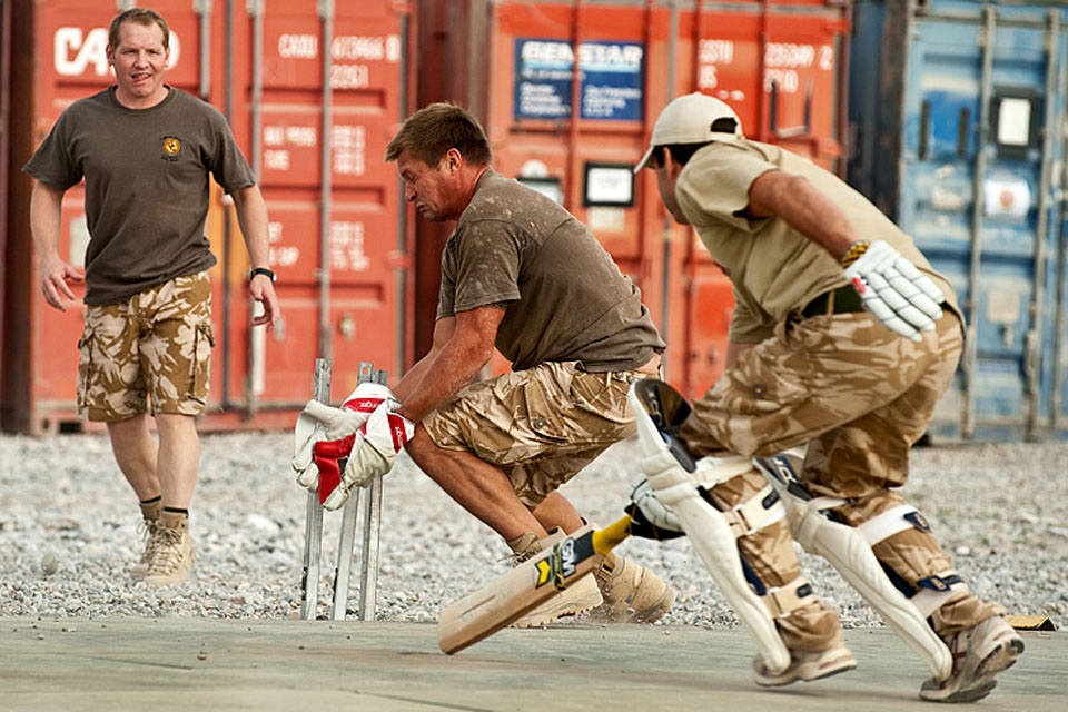 British and US Marines take part in a charity cricket match at Forward Operating Base Jackson in Sangin