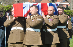 Gunner Rowbottom is carried into the cemetery. © Crown Copyright. All rights reserved