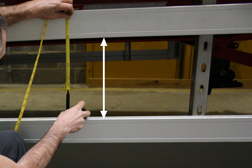 DVSA measure the gap between the rails.