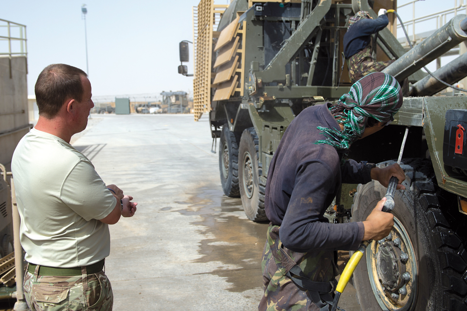 A military cargo vehicle is given a pressure wash