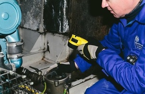 Surveyor in engine room