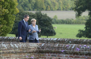 Prime Minister Cameron and Chancellor Merkl in a private meeting in the countryside