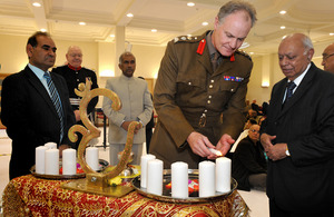 Brigadier Greville Bibby lights a candle for Diwali