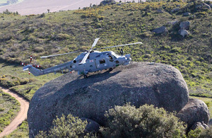 HMS Edinburgh's Lynx lands on a large boulder whilst conducting training with the South African Air Force's Super Lynx