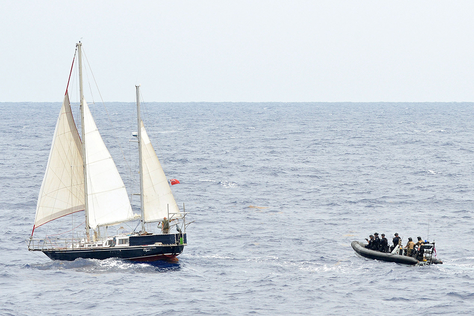 HMS Argyll's boarding team approaches the vessel suspected of carrying drugs