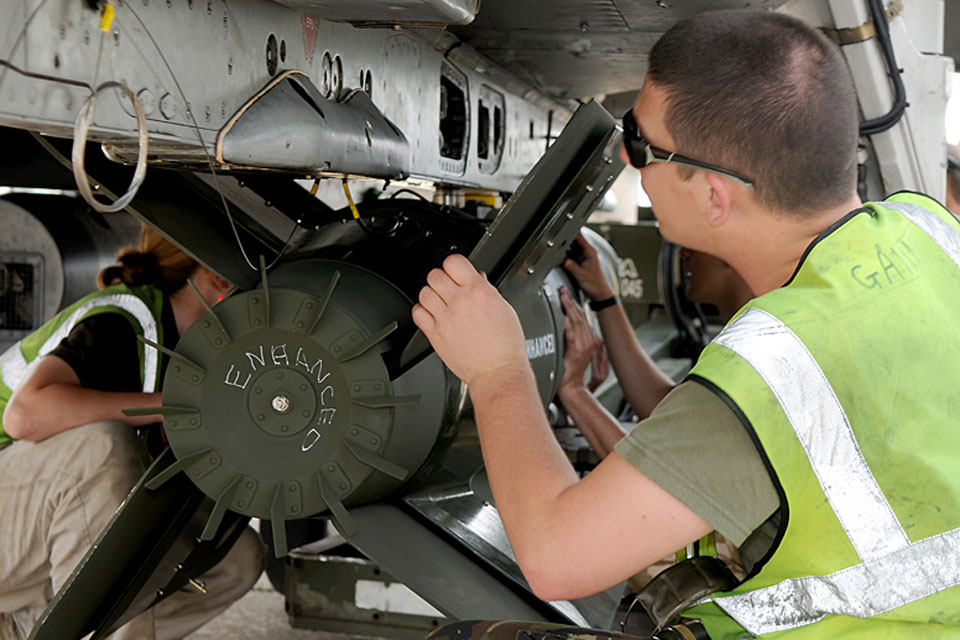 RAF armourers load Enhanced Paveway III bombs onto aircraft at Gioia del Colle air base in southern Italy 