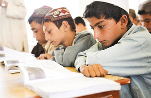 Student Samiullah (right) attending a lesson at Nad 'Ali Central School in Helmand province, Afghanistan