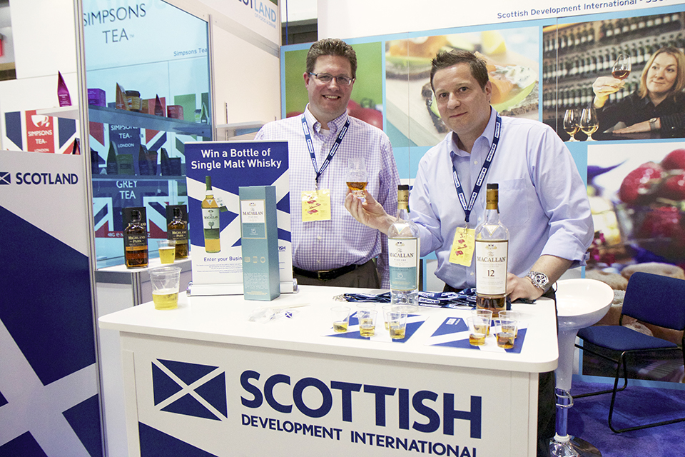 Representatives from Scottish Development International with Macallan whiskey.