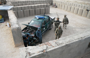 Royal Military Police passing on incident investigation skills to the Afghan Uniform Police
