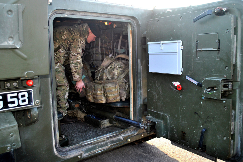 A Rifleman packs his kit 