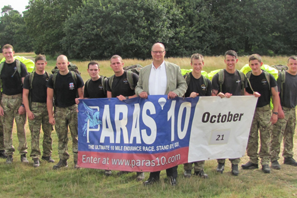 Stephen Cooper, Director of the Parachute Regiment Charity (centre), with 2 PARA soldiers before they start a test run around the Colchester PARAS' 10 course 