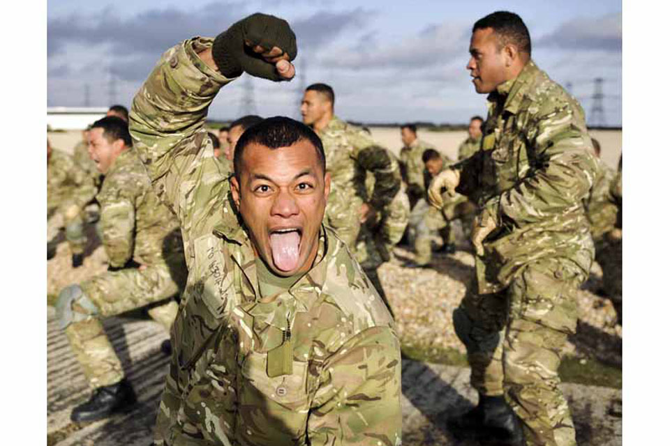 A Tongan shows his 'war face' while performing the Sipi Tau war dance during training at RAF Honington 