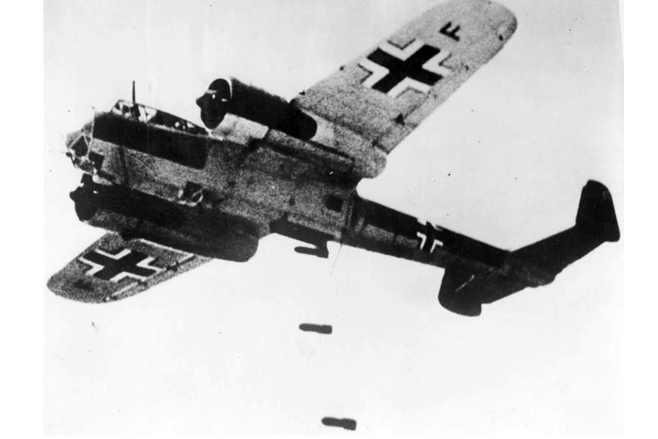 A Dornier 17 delivers its payload of bombs 