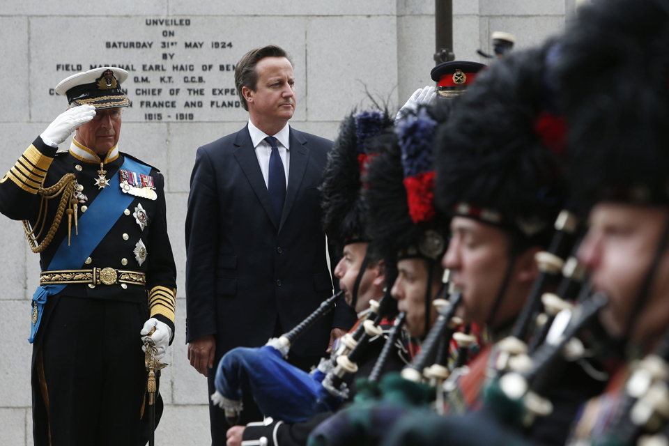 The Prince of Wales and Prime Minister David Cameron during a wreath-laying ceremony at the Cenotaph in Glasgow.