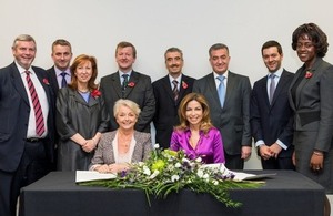 The signing ceremony. Seated (L to R): Linda Pollard, HRH Princess Ghida Talal of Jordan. Standing (L to R): Howard Lyons, Baroness Morris, Dr Geoff Hall, David Berridge, Peter Millet, Dr Asem Mansour, Zaid Bitar, Foluke Ajayi