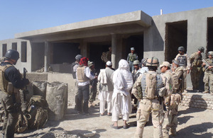 Afghans view progress of school building project