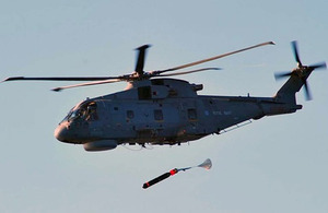 Anti-submarine torpedo is dropped from a helicopter