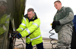 David Cummings (left) trains vehicle operator apprentice Airman 1st Class Dante Armijo of the United States Air Force at RAF Lakenheath [Picture: Staff Sergeant Stephanie Mancha, 48th Fighter Wing Public Affairs, Copyright United States Air Force]