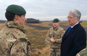 Secretary of State for Defence Sir Michael Fallon with Royal Marines from 45 Commando