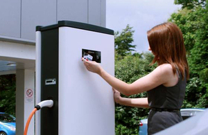 Woman at power charging point.