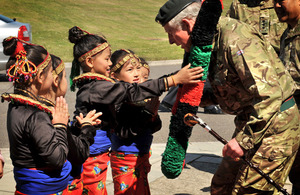 Children present Prince Charles with a garland on his arrival at Sir John Moore Barracks in Folkestone - regimental home of the Royal Gurkha Rifles [Picture: Corporal Mike O'Neill, Crown Copyright/MOD 2012]