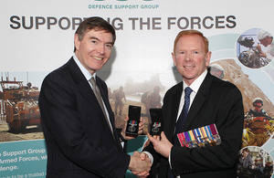Philip Dunne presents Dave Burgess of the DSG with his Afghanistan campaign medals [Picture: Corporal Anthony Stinson RAF, Crown copyright]
