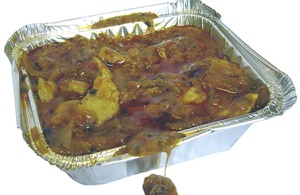 Curry in a takeaway container