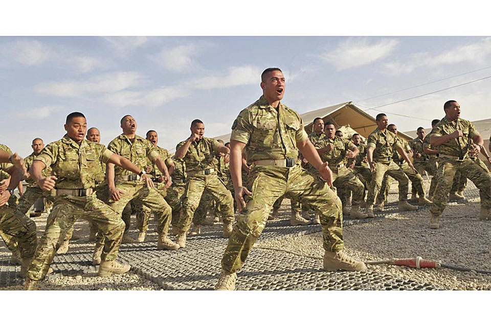 Tongan troops perform their traditional war dance, the Sipi Tau, to mark the start of their duties at Camp Bastion 