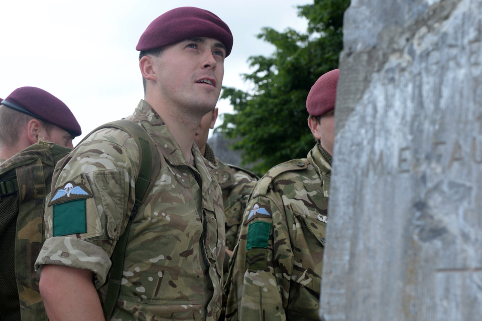 Paratroopers at a cemetery in Breville